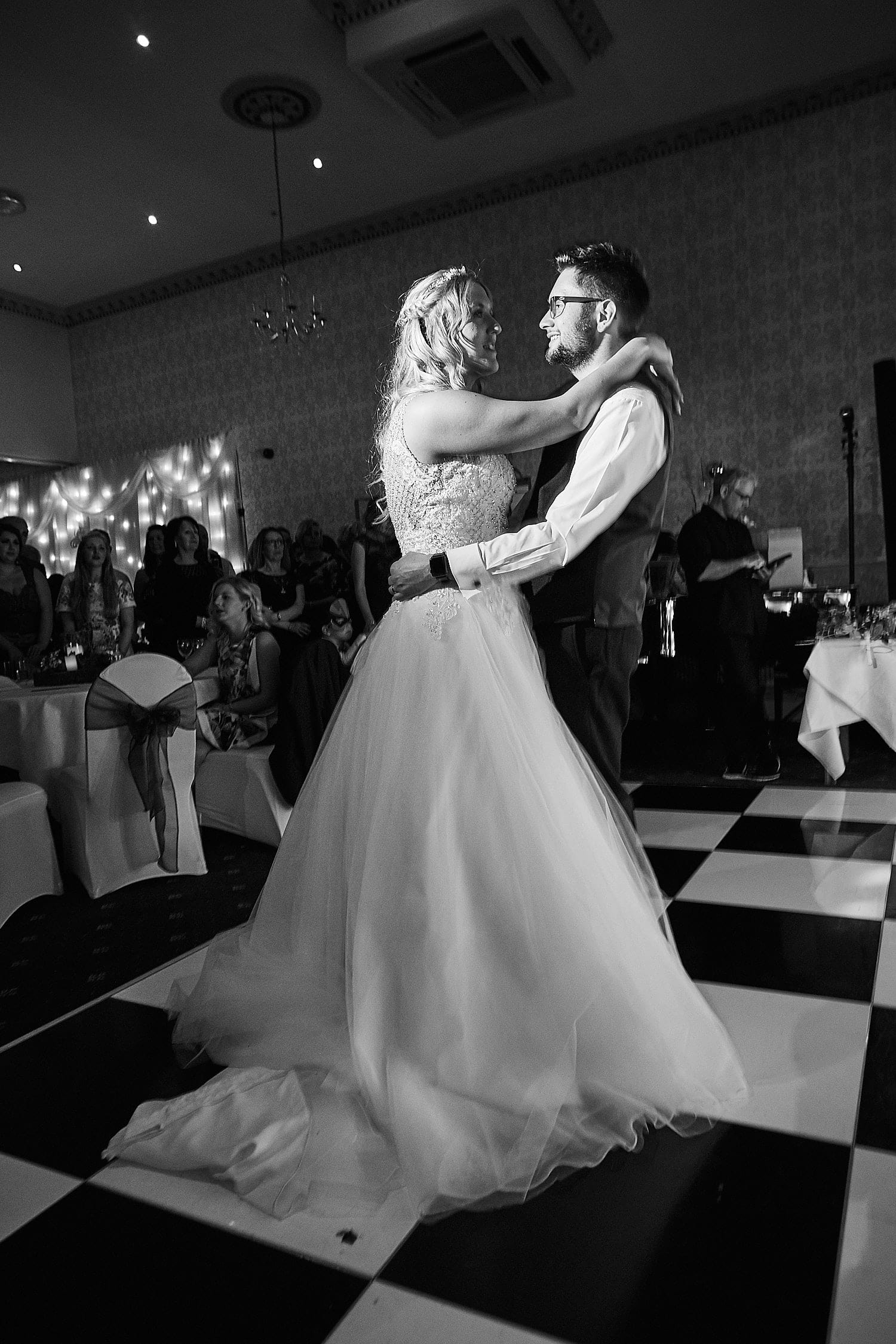 A bride and groom share their first dance on their wedding day