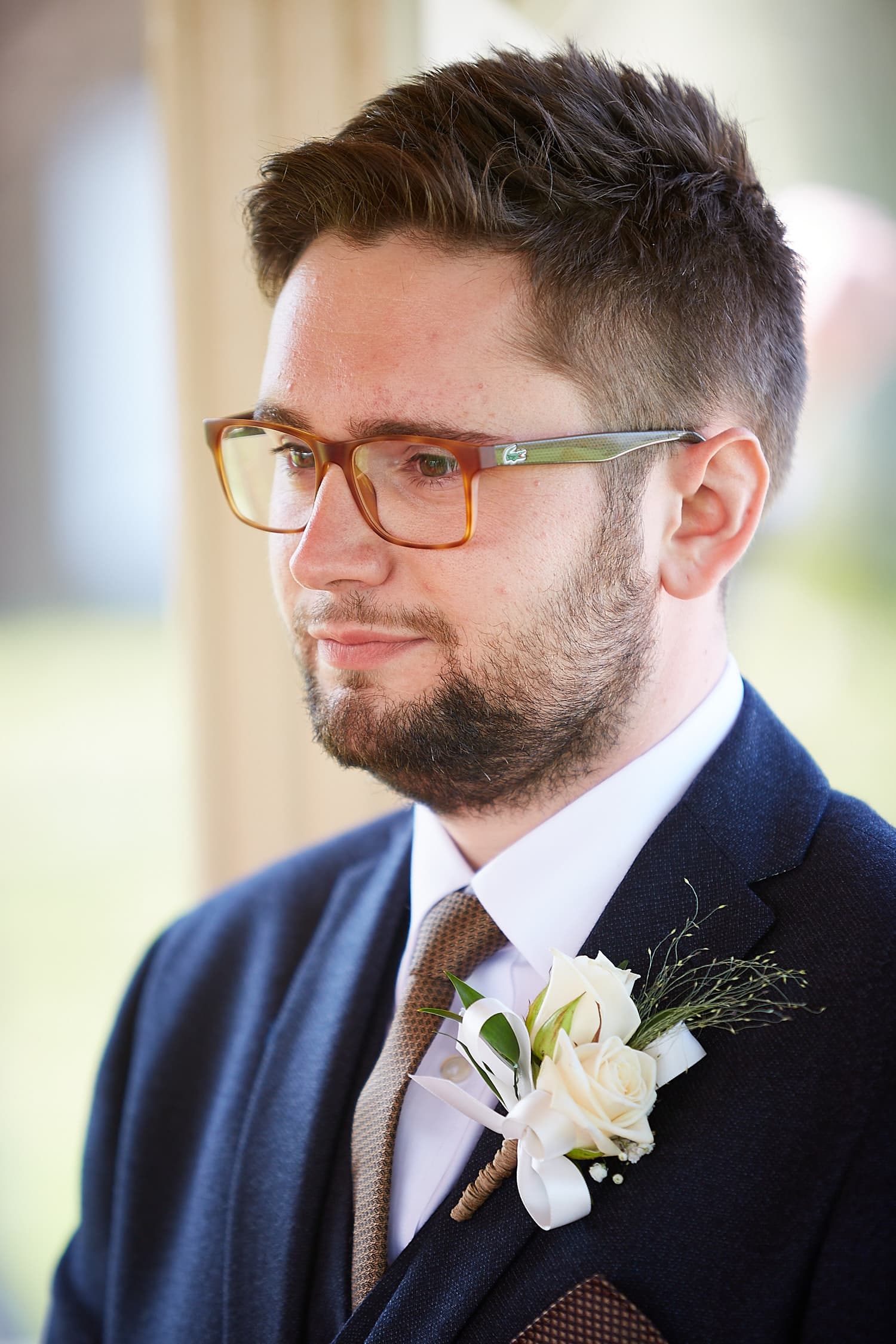 A nervous groom waiting for his bride to walk down the aisle