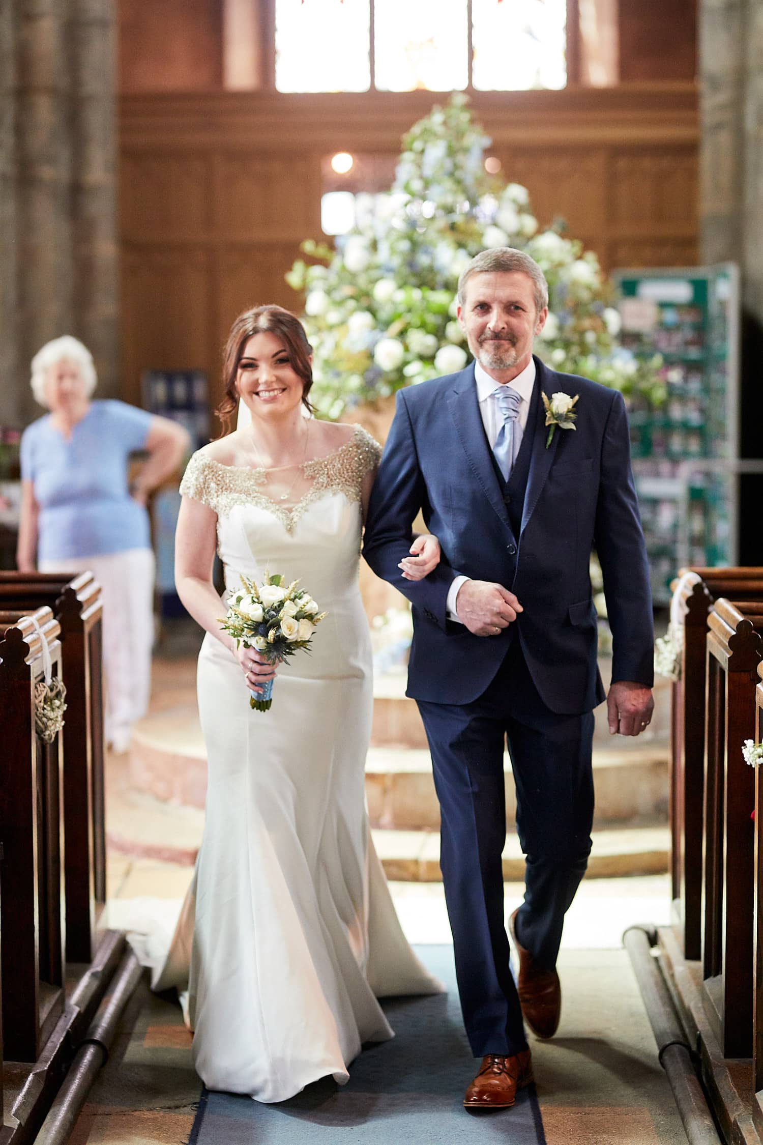 A bride walked down the aisle by her father