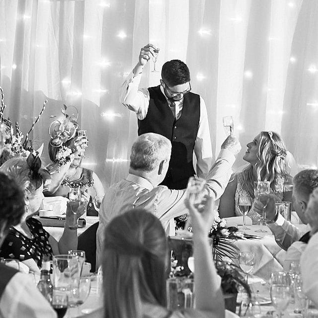 A groom toasts the guests on his wedding day during speeches in Louth