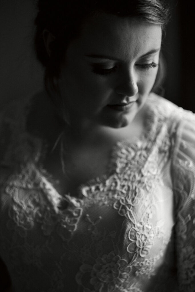 A black and white portrait of a bride on her wedding morning