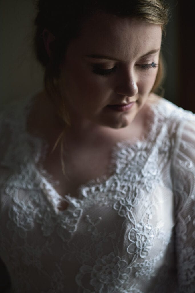A colour portrait of a bride getting ready on her wedding morning